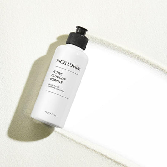 Incellderm Active Clean-Up Powder jar with powder spilling into foamy lather on hands, against a clean, natural backdrop