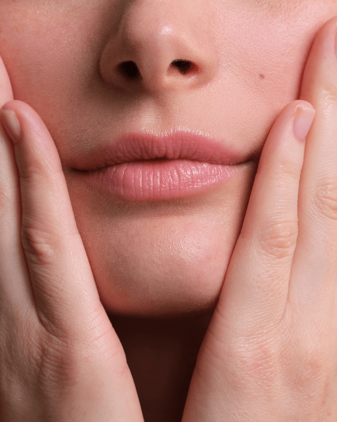 Close-up of Lip Shaper applied to lips, highlighting smooth texture and volumizing effect.