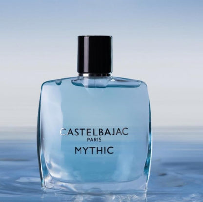 Castelbajac Paris Mythic Eau de Parfum in a sleek blue glass bottle, radiating sophistication against a backdrop of cedar forests and ocean horizons