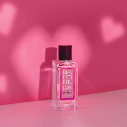 BEAUTIFUL DAY IN LOVE perfume bottle with golden-amber liquid, glowing sensually against a dusky, romantic backdrop