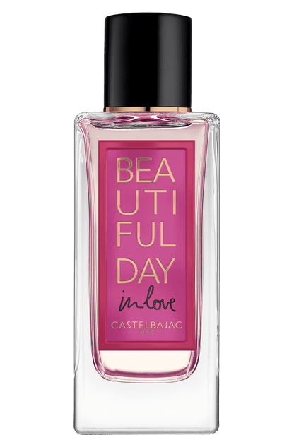 BEAUTIFUL DAY IN LOVE perfume bottle with golden-amber liquid, glowing sensually against a dusky, romantic backdrop